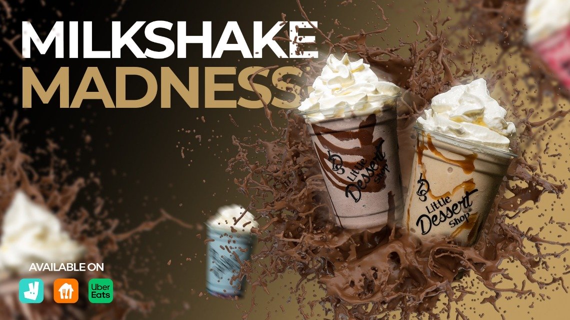 Promotional banner featuring two milkshakes with whipped cream from Little Dessert Shop. The text 'Milkshake Madness' appears in bold white and gold letters on the left side of the banner. The milkshakes, one with chocolate and the other with caramel, are